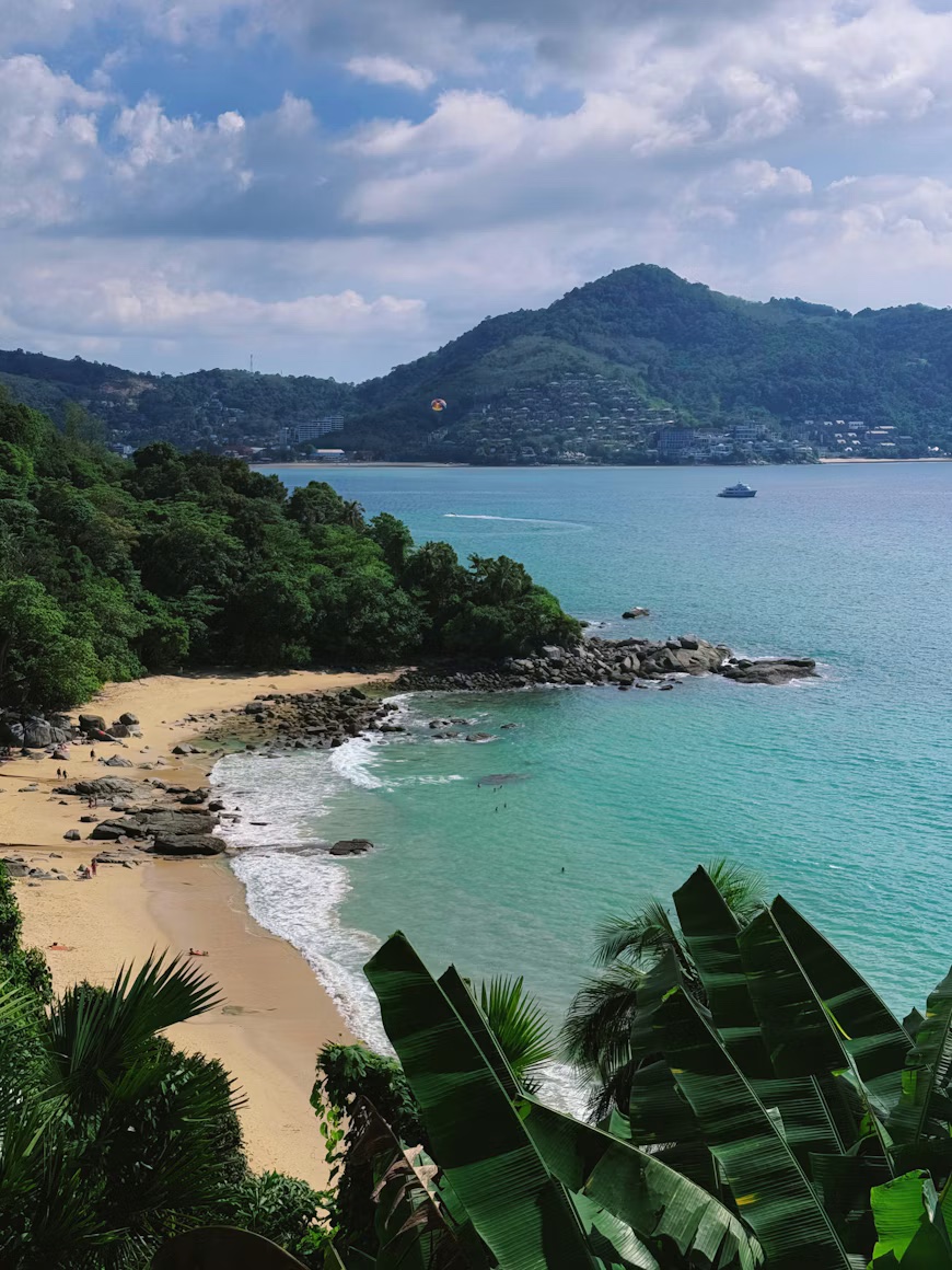 Real photograph of the green coastline and turquoise water around Kamala, Phuket