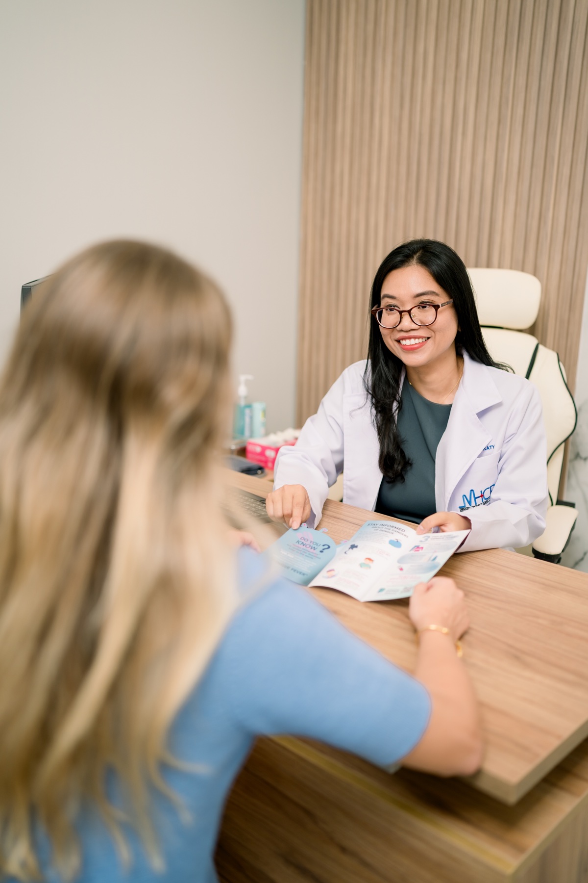 Dr. Katy speaking with a patient during a consultation at Medical Health Clinic Phuket